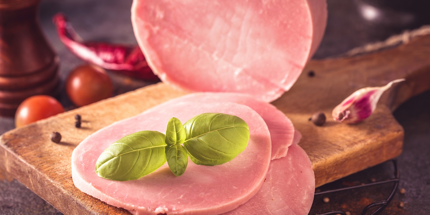Sliced ham on cutting board